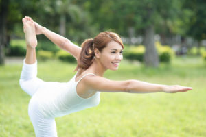 Young sport girl doing pilates